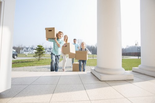 Furniture being carefully carried down stairs during a flat move