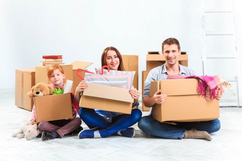 Furniture collection team handling bulky items in a Notting Hill street