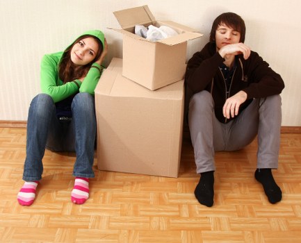 Packing and carrying belongings from a shared student house in Notting Hill