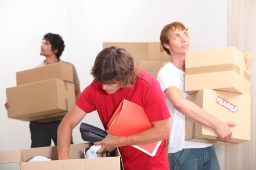Furniture removal team managing a move in a Notting Hill street