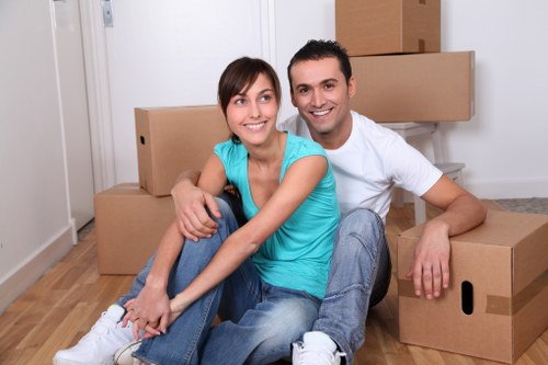 Student relocation service handling boxes and electronics in Notting Hill