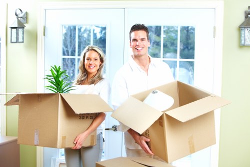 Movers loading furniture safely for a Notting Hill home move