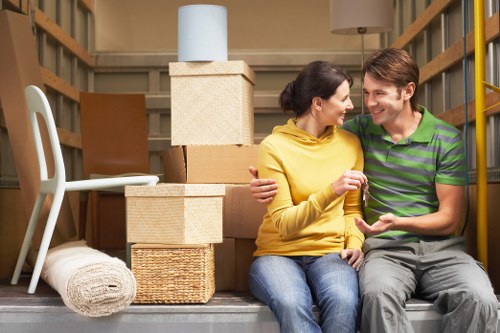 Removals team loading boxes and furniture for a Notting Hill apartment relocation