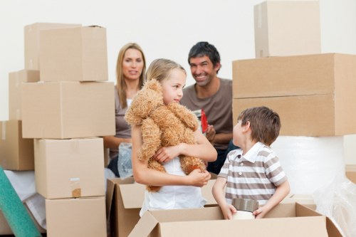 Careful loading of large furniture items from a period building